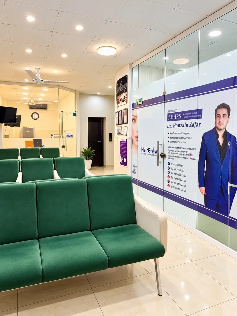 Clinic waiting area, with the surgeon's board certification displayed and the laboratory beyond